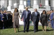  ?? PABLO MARTINEZ MONSIVAIS / AP ?? President Trump and first lady Melania Trump walk with Vice President Mike Pence and his wife, Karen, before a moment of silence for the victims of the mass shooting in Las Vegas, Monday.