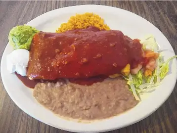  ?? RICHARD S. DARGAN/FOR THE JOURNAL ?? Carne adovada chimichang­a, one of the daily specials at Mary & Tito’s.