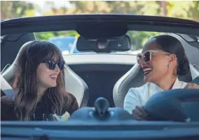  ?? GLEN WILSON/FOCUS FEATURES ?? “This is not a story about women looking for boyfriends,” says Tracee Ellis Ross (right), shown with co-star Dakota Johnson.
