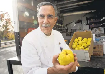  ?? LIPO CHING/STAFF PHOTOS ?? Chef Faz Poursohi checks a load of fresh quince he gets trucked in from a farmer in Fresno. At the Faz Restaurant & Bar in North San Jose, desserts come with a slice or two of quince paste, which is also sold in jars in the pastry case at the end of...