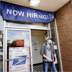  ?? ELAINE THOMPSON / ASSOCIATED PRESS ?? Amid reopenings and rehires of laid-off employees, 21 million Americans still are classified as unemployed.