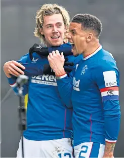  ?? ?? James Tavernier with Todd Cantwell after he had opened his Rangers account