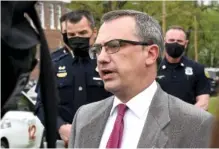  ?? STAFF PHOTO BY MATT HAMILTON ?? District Attorney Neal Pinkston speaks with members of the media during a news conference at the corner of S. Willow Street and E. 18th Street in Chattanoog­a on Wednesday.