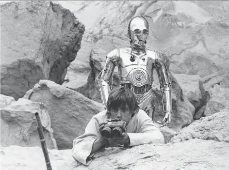  ??  ?? Luke Skywalker (Mark Hamill) and C-3P0 are startled to see vicious Tusken Raiders following their trail. After private screenings of Star Wars in early 1977, some 20th Century Fox executives and fellow directors saw flaws in the film, and questioned...