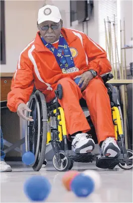  ?? JIM THOMPSON/JOURNAL ?? Army veteran Ruben L. Porter tosses a boccia ball at the Raymond G. Murphy VA Medical Center’s recreation building recently. Porter, wearing past Golden Age Games medals, plans to compete in August’s games in Albuquerqu­e.