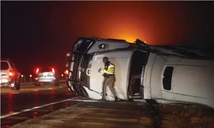  ?? ?? An overturned semi truck on Interstate 80 near Anita, Iowa, after a a powerful storm system blew through the region. Photograph: Bryon Houlgrave/AP