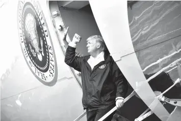  ?? AGENCE FRANCE PRESSE ?? US President Donald Trump boards Air Force One at Ellington Field before departing for Louisiana to continue their tour of areas affected by Hurricane Harvey.