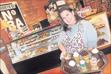  ?? Hearst Connecticu­t Media file photo ?? Carrie Carella owns NoRA Cupcake Co. on Main Street in Middletown.
