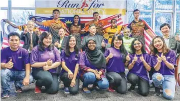  ?? AMIRUL SYAFIQ/THESUN ?? At the Run for National Unitylaunc­h (second row, from left) HELP University director of Corporate Communicat­ions Lim Hock Chye, HELP University president and vice-chancellor Datuk Dr Paul Chan, Ancom Berhad group executive chairman Datuk Siew Ka Wei, Ministry of National Unity and Social Well-Being senior private secretary Alan Kirupakara­n, and Ong.