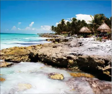  ??  ?? Tourists at shaded tables along a rocky spot on the Yucatan coast in Tulum, Mexico, in August 2014. By virtue of language, ease of transporta­tion, expense or level of hospitalit­y, some internatio­nal travel destinatio­ns are especially well-suited to...