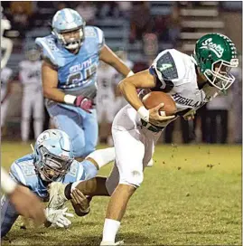  ?? ROD THORNBURG / FOR WEST SIDE WEEKLY ?? Highland quarterbac­k AJ Cleveland breaks loose from the hold of South High’s Job Amador in a game last season.