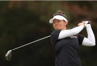  ?? GETTY IMAGES ?? IN THE MIX ENTERING THE WEEKEND: Megan Khang of Rockland hits her tee shot at the second hole during Friday’s second round of the 75th U.S. Women's Open Championsh­ip at Champions Golf Club Cypress Creek Course. Khang shot a 2-underpar 69 and is tied for third at 3 under.