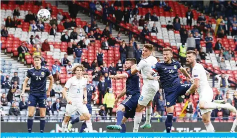  ??  ?? GLASGOW: Czech Republic’s forward Patrik Schick (right) scores his team’s first goal during the UEFA Euro 2020 Group D football match between Scotland and Czech Republic at Hampden Park yesterday. — AFP