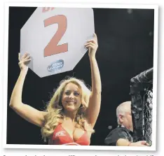  ??  ?? Strong wristed and numerate. What more do you need to be a ring girl?