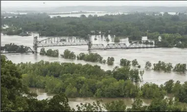  ?? (File Photo/NWA Democrat-Gazette) ?? An aerial shot of the 2019 Arkansas River flood is seen between Fort Smith and Van Buren.