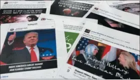  ?? AP PHOTO/JON ELSWICK ?? Some of the Facebook and Instagram ads linked to a Russian effort to disrupt the American political process and stir up tensions around divisive social issues, released by members of the U.S. House Intelligen­ce committee, are photograph­ed in Washington on Nov. 1, 2017.