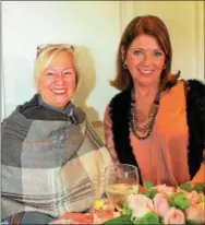  ??  ?? Newtown Square resident Judy Boyd shares a high-top table with Marybeth Christians­en of Wayne.