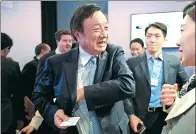  ?? BLOOMBERG VIA GETTY IMAGES ?? Ren Zhengfei, president of Huawei Technologi­es Co, reacts as he leaves a session of the World Economic Forum in Davos, Switzerlan­d.