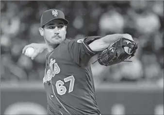  ?? BILL KOSTROUN/AP PHOTO ?? Mets pitcher Seth Lugo delivers to the Yankees during the first inning of Sunday’s game at Citi Field.