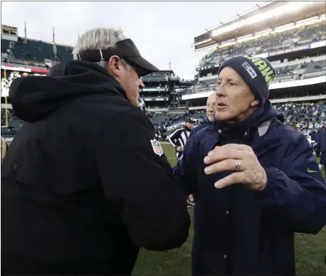  ?? MATT ROURKE – THE ASSOCIATED PRESS ?? Eagles head coach Doug Pederson, left with a warm greeting for Seattle Seahawks head coach Pete Carroll recently in chilly weather, figures it’s about now-or-never time for his 5-7 team to really get to work.