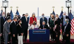  ?? New York Times file photo ?? House Speaker Nancy Pelosi and Senate Majority Leader Chuck Schumer stage a signing ceremony for the American Rescue Plan in March of last year.