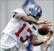  ?? JULIO CORTEZ- THE ASSOCIATED PRESS ?? In this Aug. 8, 2017, file photo, New York Giants wide receiver Odell Beckham works out during NFL football training camp, in East Rutherford, N.J. After a miserable end to the 2016 season and the brouhaha about his desire to be the NFL’Äôs highest...