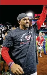  ?? ROB CARR / GETTY IMAGES ?? Nationals manager Dave Martinez celebrates after Washington won Game 4 to complete a sweep of St. Louis in the NLCS.