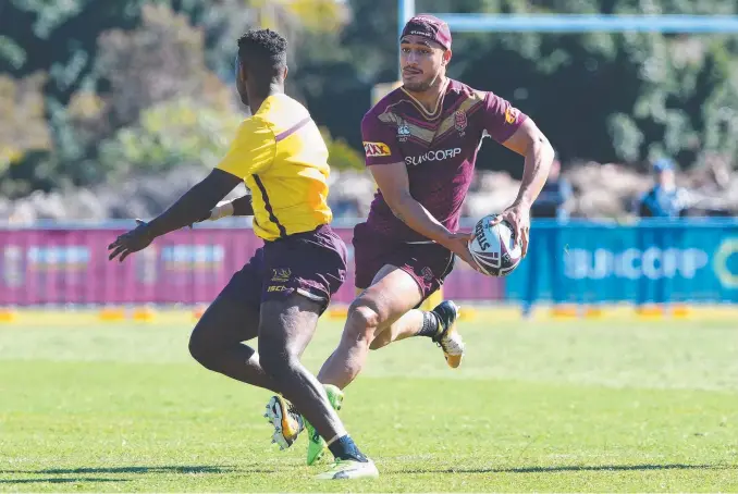  ??  ?? Valentine Holmes on the move at Maroons training at Sanctuary Cove yesterday and (below) scoring a try on debut in Origin II. Pictures: AAP IMAGE