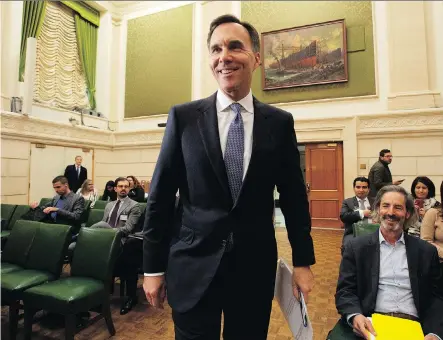  ?? ADRIAN WYLD/THE CANADIAN PRESS ?? Finance Minister Bill Morneau is facing heightened concerns about Canadian competitiv­eness after a report from the Senate banking committee called for an urgent revamp of Canada’s tax and regulatory system.