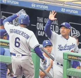  ?? CHARLES LECLAIRE, USA TODAY SPORTS ?? Manager Dave Roberts, right, says his team can turn it around: “I think we are very equipped to win 11 games in October.”