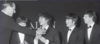  ??  ?? The Fab Five: Prince Philip presents a music award to The Beatles in London in 1964