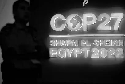  ?? MOHAMED ABD EL GHANY • REUTERS ?? A security person stands guard next to the COP27 sign during the closing plenary at the COP27 climate summit in Red Sea resort of Sharm el-sheikh, Egypt on Sunday.