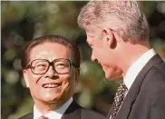  ?? Wilfredo Lee/Associated Press 1997 ?? China President Jiang Zemin smiles at President Bill Clinton during a White House arrival ceremony.