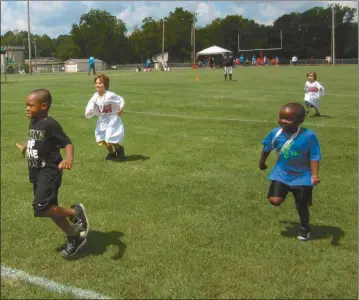  ?? Tricia Cambron/SJ ?? And they’re off - This group of 5-and-6-year-old boys led the field for the 40-yard dash at the Youth Summerfest Olympics held in Cedartown Saturday, July 29.