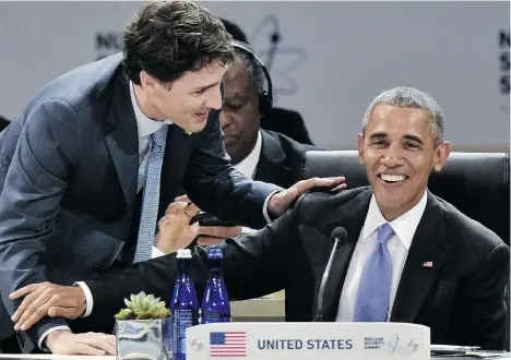  ?? MANDEL NGAN/AFP/GETTY IMAGES ?? U.S. President Barack Obama chats with Prime Minister Justin Trudeau Friday during the last of four nuclear safety summits organized by the U.S.