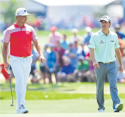  ??  ?? Gary Woodland, left, and Kevin Kisner during the second round of the PGA Championsh­ip at Bellerive.