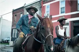  ??  ?? Idris Elba and Caleb McLaughlin in Concrete Cowboy.