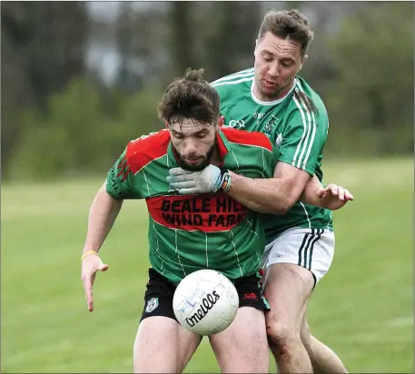  ?? Photo by John Stack ?? Paud Costelloe, Ballyduff trying to prevent Cormac Linnane, Beale getting the ball during the County Junior Championsh­ip semi-final played in Coolard on Saturday evening