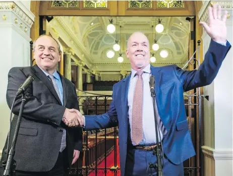  ?? DARREN STONE, TIMES COLONIST ?? B.C. Green Party Leader Andrew Weaver and B.C. NDP Leader John Horgan at the legislatur­e on Monday after announcing their agreement to form a minority provincial government.