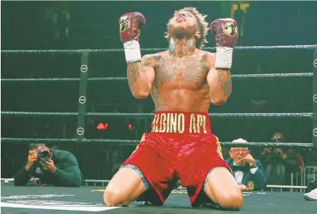  ?? TAMI CHAPPELL/AP ?? Malik Hawkins reacts after winning a super lightweigh­t bout against Darwin Price in the fifth round Dec. 28, 2019, in Atlanta.