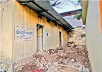  ?? DC ?? Galvanised iron sheets put up at one of the washroom blocks, while the debris is still not cleared despite many complaints to the GHMC.
—