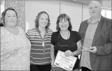  ?? SUBMITTED PHOTO ?? Donna, second right, and Ron Profit, right, receive the honourary lifetime achievemen­t award at the Swim P.E.I. award presentati­ons. The award recognized the many years of volunteer service both have given to swimming in the province. The Profits were...