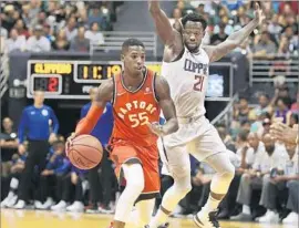  ?? Marco Garcia Associated Press ?? PATRICK BEVERLEY, shown guarding Toronto’s Delon Wright in a preseason game in Honolulu this week, says, “I try to set the tone defensivel­y.”