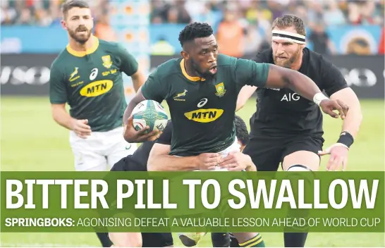  ?? Picture: Gallo Images ?? NOT SO FAST. Springbok captain Siya Kolisi is tackled by All Blacks centre Ryan Crotty during their Rugby Championsh­ip Test at Loftus Versfeld on Saturday. The Kiwis won 32-30.