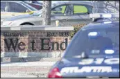  ??  ?? Police block off a section of Ralph David Abernathy Boulevard after a shooting at The Mall West End in Atlanta.