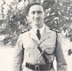  ??  ?? Fletcher, above, in dress uniform preparing to receive his George Medal, and below, with his wife Gwynne outside their house in Kuala Pilah on the evening before his award was announced