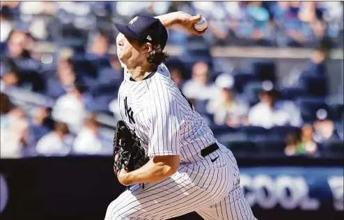  ?? Jessie Alcheh / Associated Press ?? New York Yankees starting pitcher Gerrit Cole deals against the Cleveland Guardians during the seventh inning on Sunday in New York.