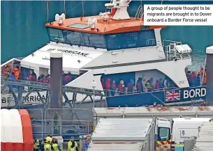  ?? ?? A group of people thought to be migrants are brought in to Dover onboard a Border Force vessel
