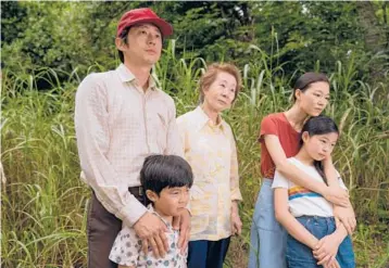  ??  ?? Steven Yeun, from left, Alan Kim, Yuh-Jung Youn, Yeri Han and Noel Cho in Lee Isaac Chung’s“Minari.”
