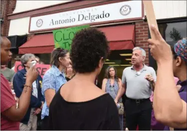  ?? TANIA BARRICKLO — DAILY FREEMAN ?? Steve Greenfield of New Paltz, in gray shirt, speaks during the ‘Close the Camps’ demonstrat­ion on Tuesday outside Rep. Antonio Delgado’s office on Clinton Avenue in Kingston N.Y.